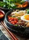 delicious-bibimbap-served-hot-stone-bowl-with-side-dishes