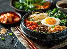delicious-bibimbap-served-hot-stone-bowl-with-side-dishes